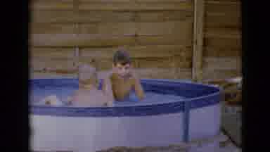 Clarksdale Arizona (1968): Two Kid Brothers Having Fun And Playing In A Swimming