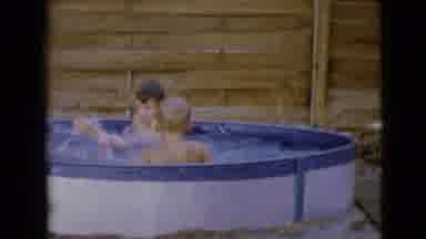 Clarksdale Arizona-1968: Two Boys Playing In An Small Outside Pool On A Summer
