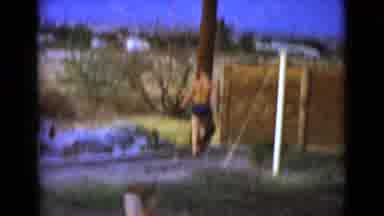 Clarksdale Arizona (1968): Multiple Kids Playing Outside In The Mud By A Wooden