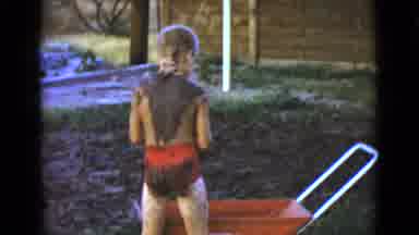 Clarksdale Arizona (1968): Young Child Playing And Falling In The Mud