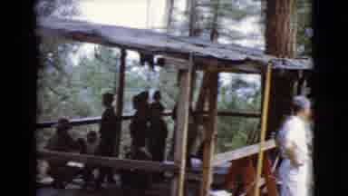 Clarksdale Arizona (1968): People Sit Under A Rustic Outdoor Hut In The Forest