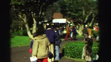 Reno Nevada (1969): People Dressed For Cool Weather Walk On Paved Path In Some