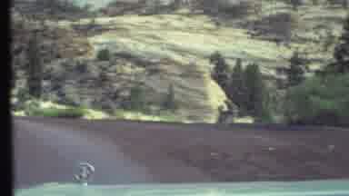 Grand Canyon Arizona (1972): A Vehicle Drives Down The Road Into A Mountainous