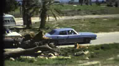 Grand Canyon Arizona (1972): A Car Driving Down The Highway And Another Car Parked