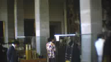 Mexico City (1973): People Look At Museum Items That Are Stored Under Glass