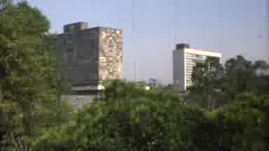 Mexico City (1973): Camera Zooming In And Out Of Buildings Located Near Trees