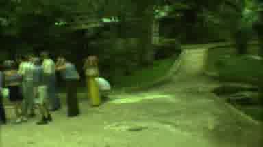 Yucatan Mexico (1973): Group Of People Looking At A Stone Arch In A Garden