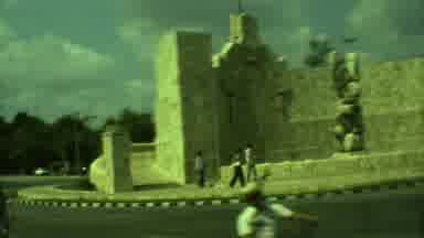 Yucatan Mexico (1973): People Walking By Some Historical Ruins On A Cloudy Day