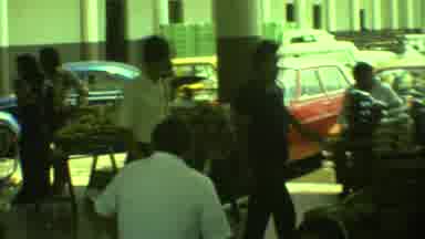 Yucatan Mexico (1973): Man Wearing Tan Shirt Walking Through Busy Indoor