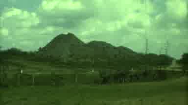 Yucatan Mexico (1973): A Mountain Of Rocks And Stones And A Man Is Walking Near It