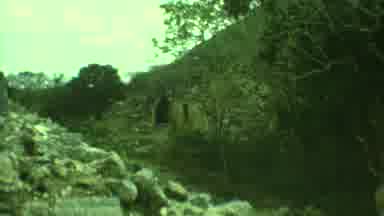 Yucatan Mexico (1973): Man Climbing On A Stone Building On A Sunny Day And With