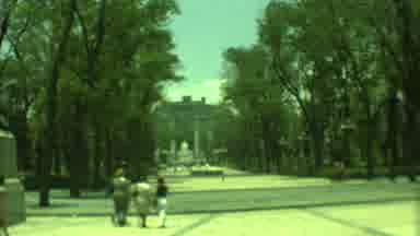 Yucatan Mexico (1973): People Walking Down A Street Way In Front Of A Building