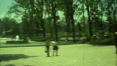 Yucatan Mexico (1973): Two Ladies Passing Through A Park While A Young Child Skips