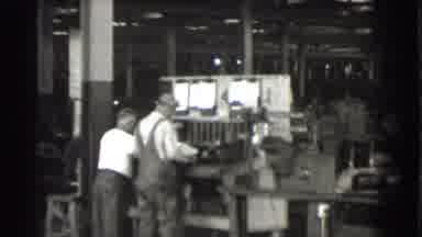Cleveland Ohio USA (1939): Two Men Work Together In The Factory As Camera Pans