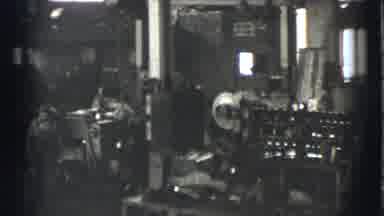 Cleveland Ohio USA (1939): Workers In A Factory Working On Machines And Walking