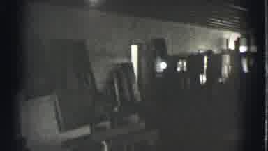 Cleveland Ohio USA (1939): A Dark Factory, Warehouse, Or Garage Is Shown, Lighted