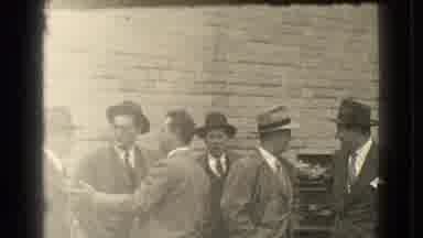 Cleveland Ohio USA (1939): Several Men Wearing Coats And Hats Stand Around Talking