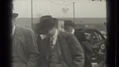 Cleveland Ohio USA (1939): A Few Men Walk Together Talking While Wearing Overcoats