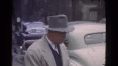 Cleveland Ohio USA (1939): Man In Coat And Hat Walking Around Parked Cars And Red
