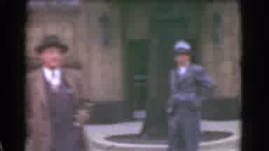 Cleveland Ohio USA (1939): Man Waiting To Cross The Street Then Crosses Towards A
