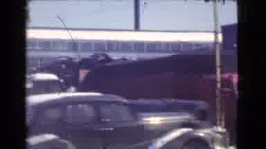 Cleveland Ohio USA (1939): A Panning Shot Of Vehicles In A Junkyard, Followed By A