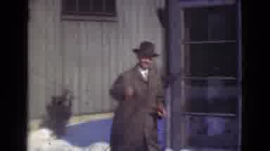Cleveland Ohio USA (1939): A Man In A Suit Walks And Waves At The Camera With A