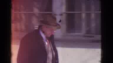 Cleveland Ohio USA (1939): Man Wearing Black Coat Smiles For Camera While Walking