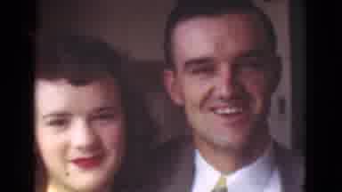 Cleveland Ohio USA (1939): Man Talking Next To Woman On A Street With Houses And