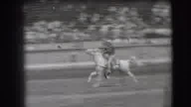 Denver Colorado USA (1941): Cowboy Rides Horse In Arena During Rodeo Event Raises