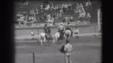 Denver Colorado USA (1941): Lots Of Horses In An Arena As One Man Is Being Bucked