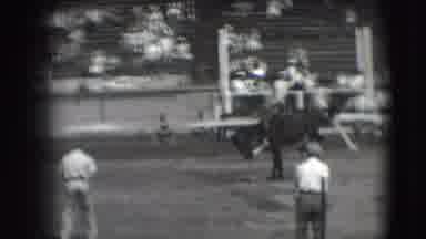 Denver Colorado USA (1941): Man Riding A Horse In A Arena While People Watch