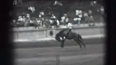 Denver Colorado USA (1941): A Man Riding A Horse In A Rodeo Setting With People