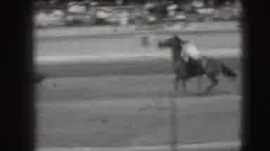 Denver Colorado USA (1941): Athletes On Horseback Attempting To Wrangle Baby