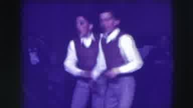 Joliet Illinois USA (1941): Twins Wearing Brown Vests Dance And Stand With Woman