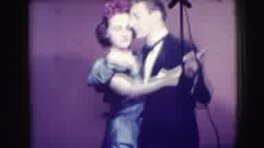 Joliet Illinois USA (1941): Man In Tuxedo And Woman In Dress Dancing Cheek To