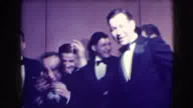 Joliet Illinois USA (1941): Group Of Guys In Black Tuxedos Dance Around And Act