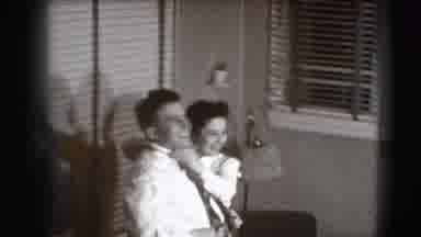 Joliet Illinois USA (1941): Black And White Clip Of Woman Adjusting Man's Tie As