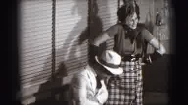 Joliet Illinois USA (1941): A Man And Woman Pose In Classy Garb In A Home Setting