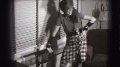 Joliet Illinois USA (1941): Woman Wearing Feathered Hat Stands Next To Window With