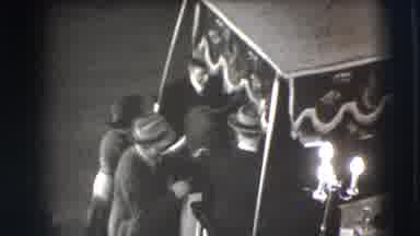 Joliet Illinois USA (1941): A Man Sitting At A Table As Another Person Joins Him