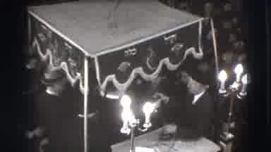Joliet Illinois USA (1941): Man Sitting With Others Under A Canopy Pours Someone A