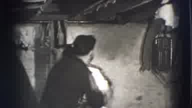 Joliet Illinois USA (1941): Two Men Basement Play Fighting Wearing Old Clothes One