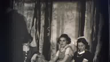 Joliet Illinois USA (1941): Man Wearing Black Shirt Holds White Pipe In Mouth On