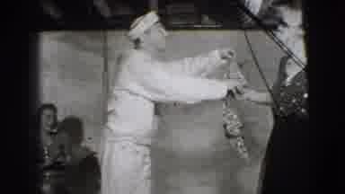 Joliet Illinois USA (1941): A Man Conversing With A Woman And Gives Her A Clothing