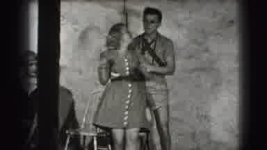 Joliet Illinois USA (1941): Happy Man Grabs Woman And Twirls Her Both Smile And