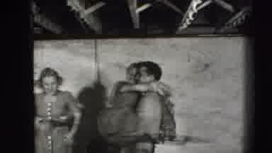 Joliet Illinois USA (1941): An Excited Couple Dancing And Kissing