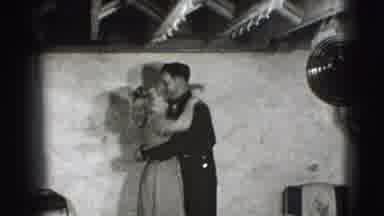 Joliet Illinois USA (1941): Young Man Hugs And Kisses Two Girls In Small Room