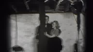 Joliet Illinois USA (1941): Woman And Man In Black And White Link Arms And Walk