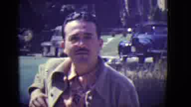 East Orange New Jersey (1946): A Man With Dark Moustache And Glasses Leans Against