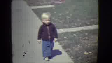 East Orange New Jersey (1946): Little Blonde Boy Walking On A Sidewalk And